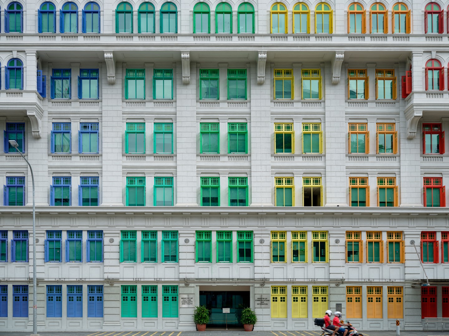 A bright, cheerful colour scheme was chosen to enliven the otherwise stern facade of Old Hill Street Police Station, Singapore